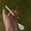 Bombilla de plata y oro